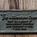 A plaque on Dirrington Little Law Millennium Cross