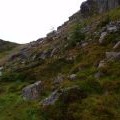 Gloomy rock wall above Binnean nan Gobhar's lochan