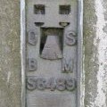 OSBM flush bracket on the trig point on Hadrian's Wall above Winshield Crags