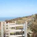 Kissing gate at the path junction where the summit path is joined by a path from the north